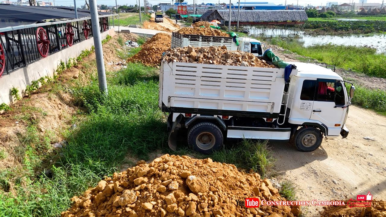 Perfectly Komatsu Dozer techniques push soil, Dump 5ton Trucks loading soil land fill up build road