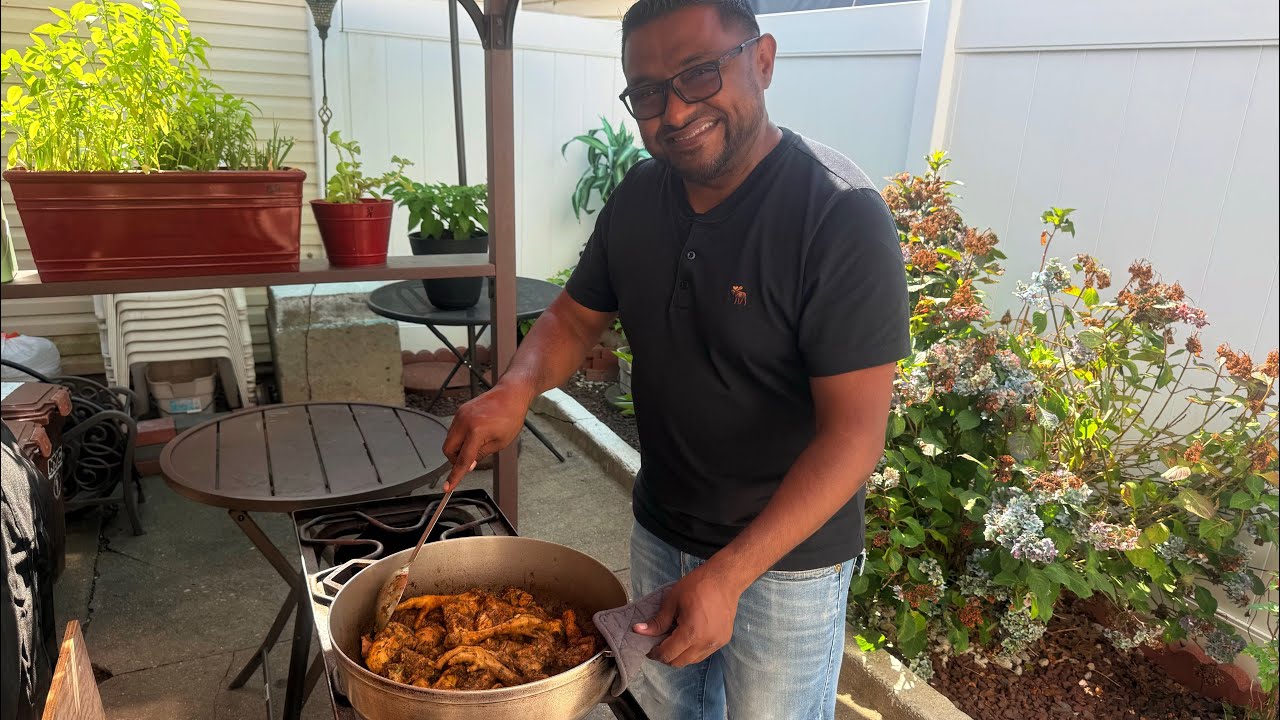 Men in the kitchen! Ricky cooking chicken curry/curry chicken and enjoying a beautiful day!