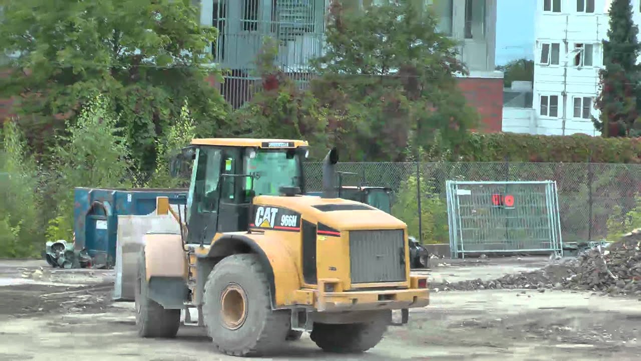 CAT 966H Loading Trucks With Crushed Debris
