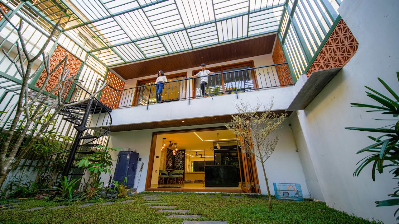 HITHAM-BEAUTIFUL CONTEMPORARY KERALA HOME WITH TROPICAL LANDSCAPE/MODERN INTERIORS