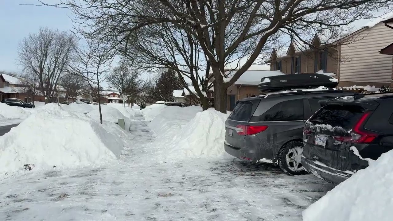 Walking Through A Quiet Snowy Neighborhood