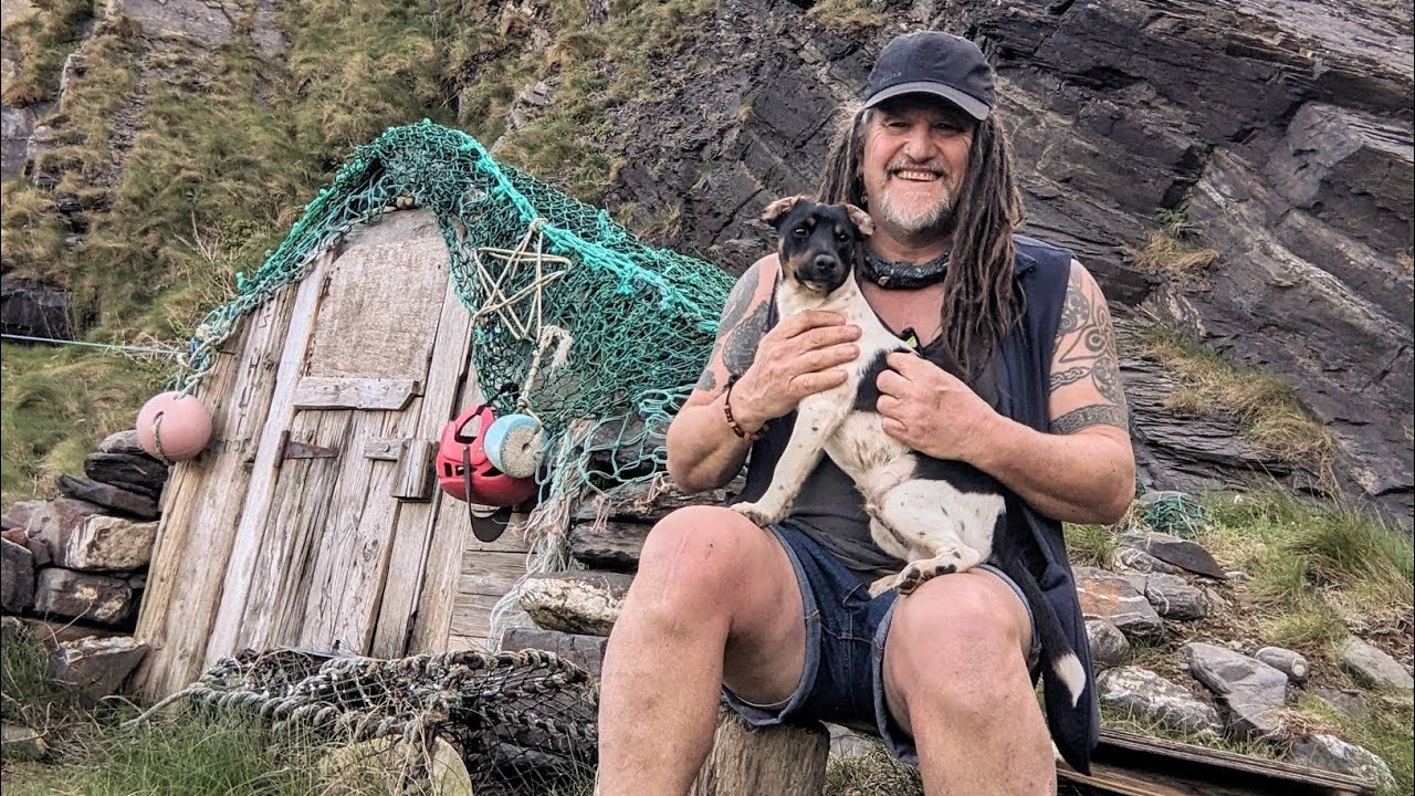 Hiking barefoot to a remote Cornish hermit beach and hut
