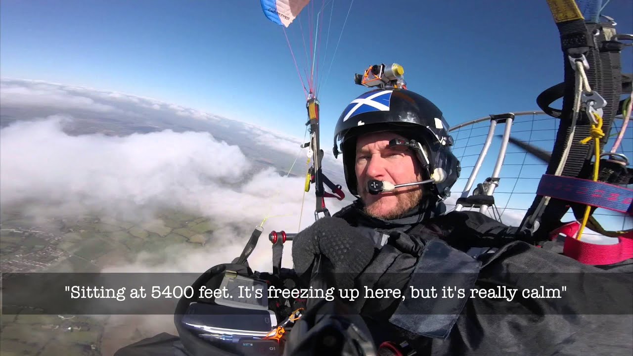 Paramotor Flight into the Clouds - with circular rainbow (Glory)