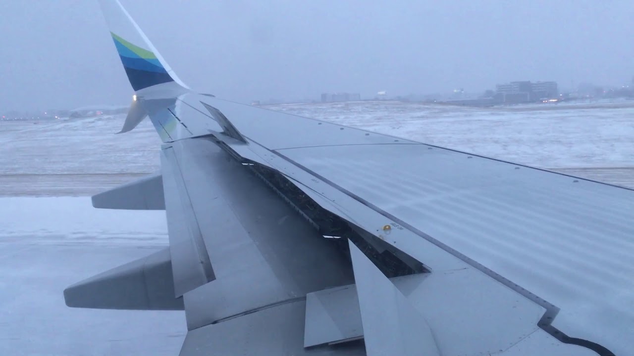 Alaska Airlines Flight 56 snow landing at Chicago O'Hare Runway 9L