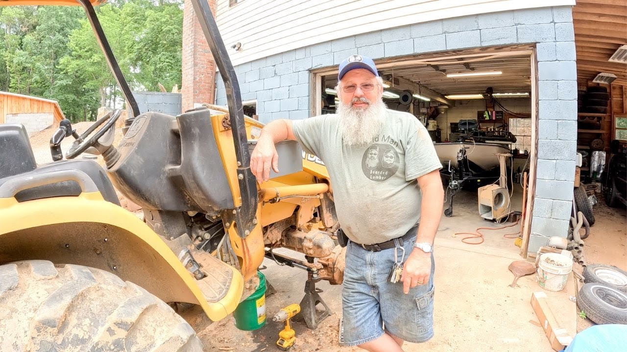 Replacing the steering cylinder on our John Deere 110 Backhoe!