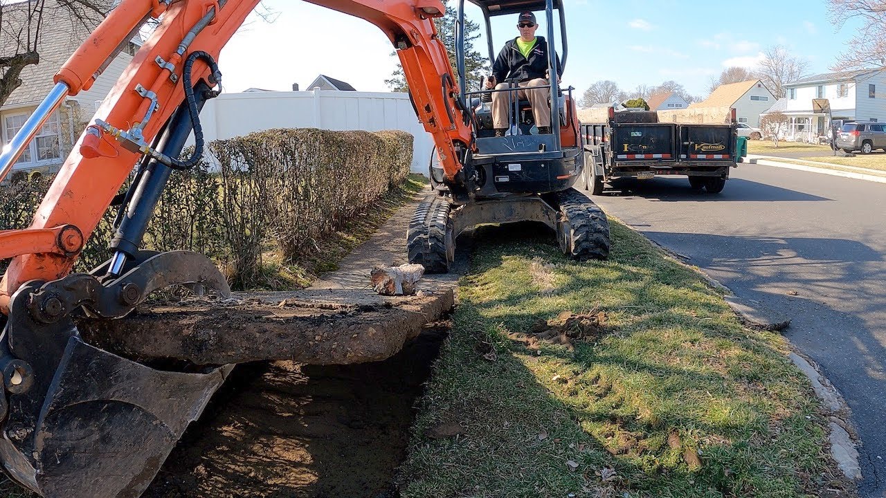 Sidewalk removal with Mini Excavator