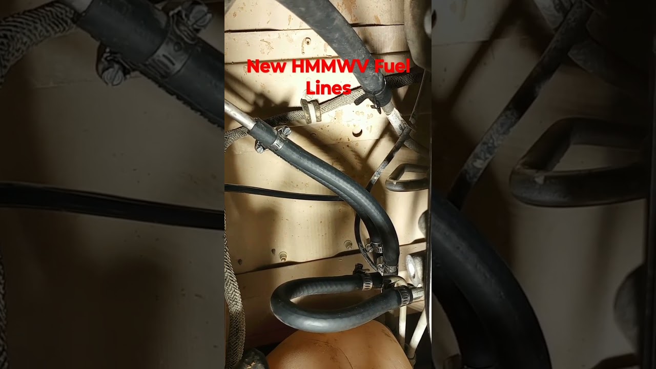 Replacing cracked HMMWV rubber fuel lines.