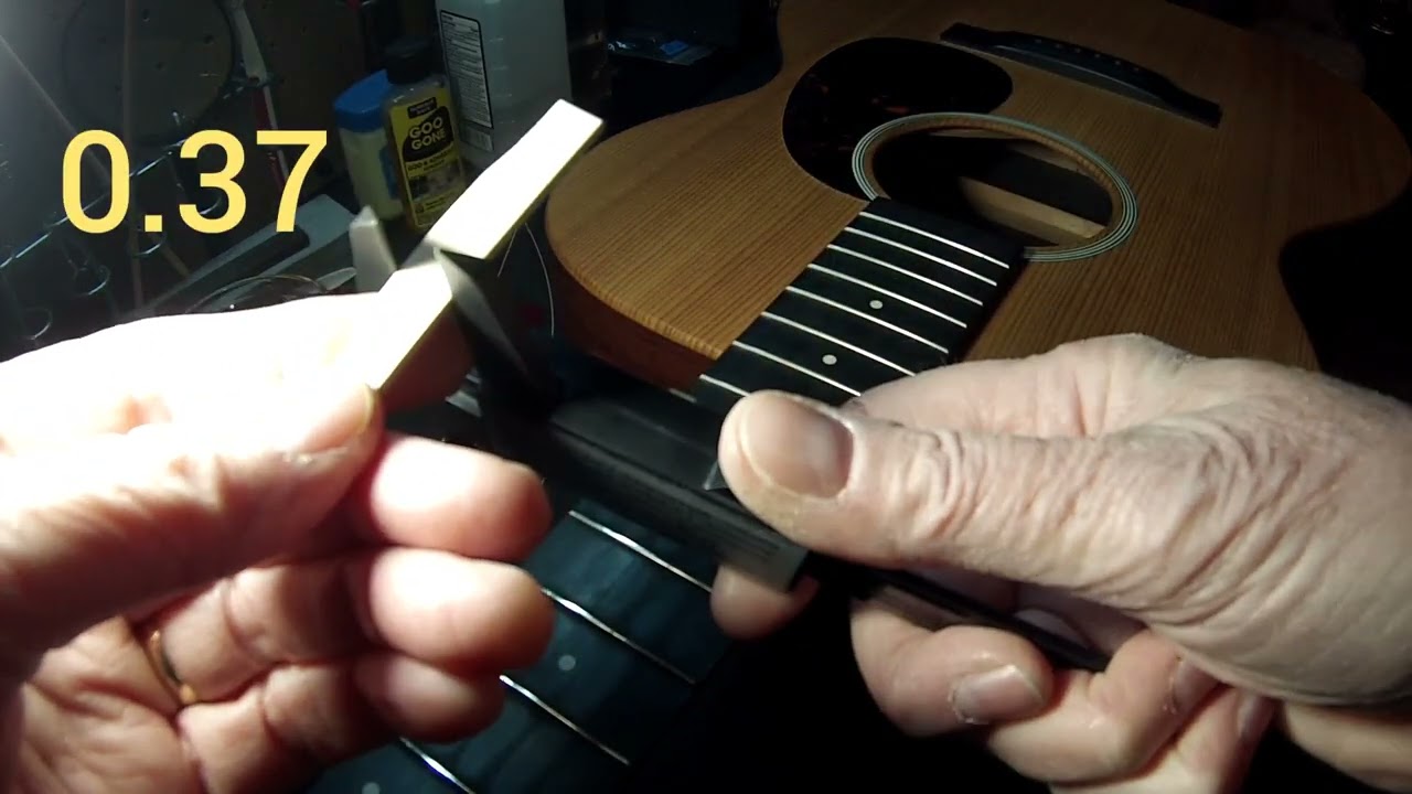 how to lower action on martin acoustic