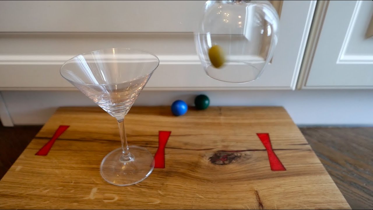 How to move the olive to the glass without touching olive, or martini glass