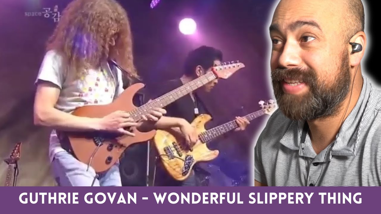 “Is Guthrie Govan Even Human? 🎸 Classical Guitarist Reacts to ‘Wonderful Slippery Thing’”