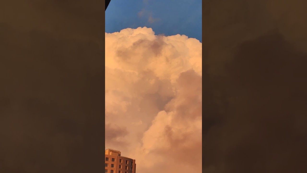Huge Cloud Highlighted by Sun moving fast