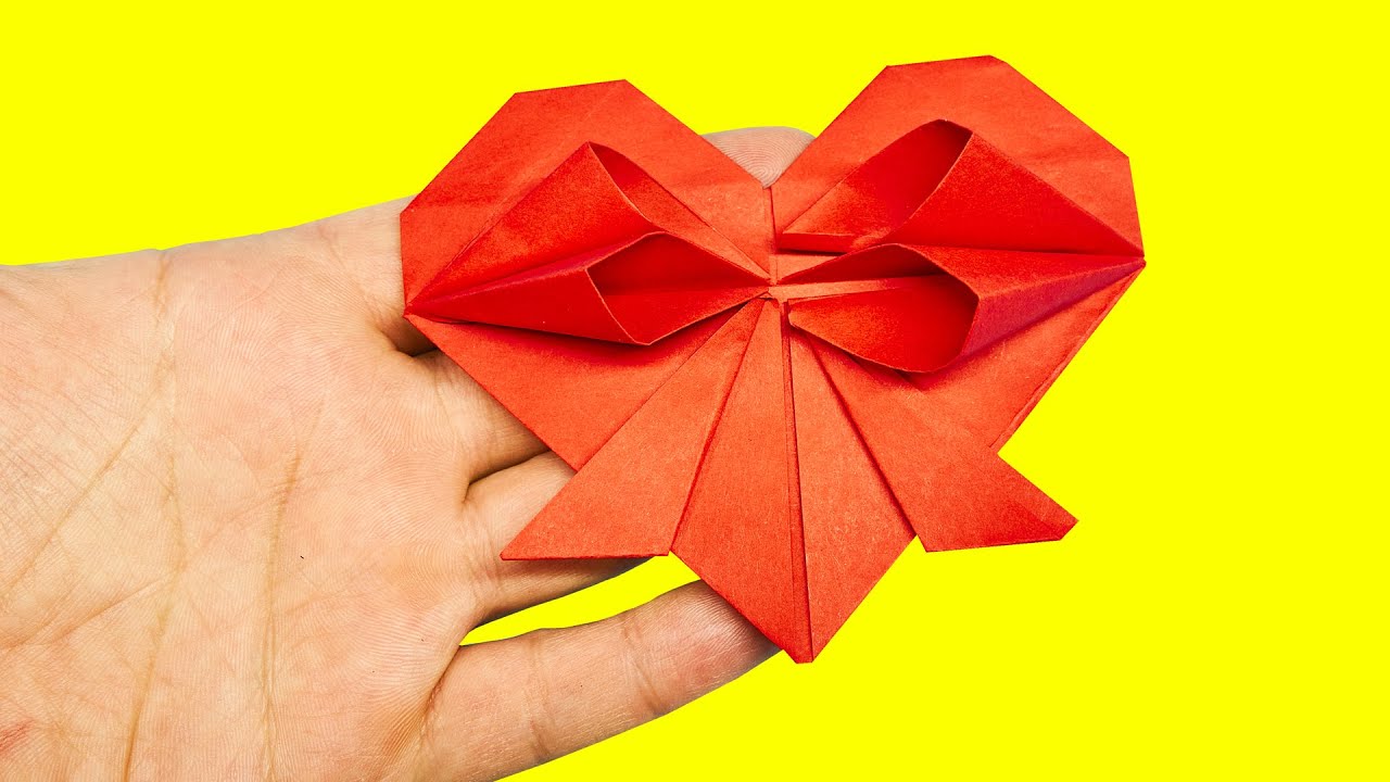How to make paper origami heart with bow and full instruction text. Paper Crafts