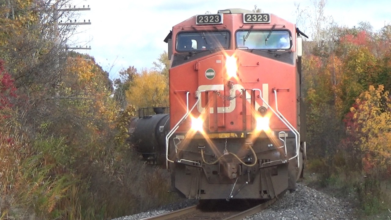 Long Freight Train CN 507 Rolling into Moncton, NB as Sun Disappears behind Clouds