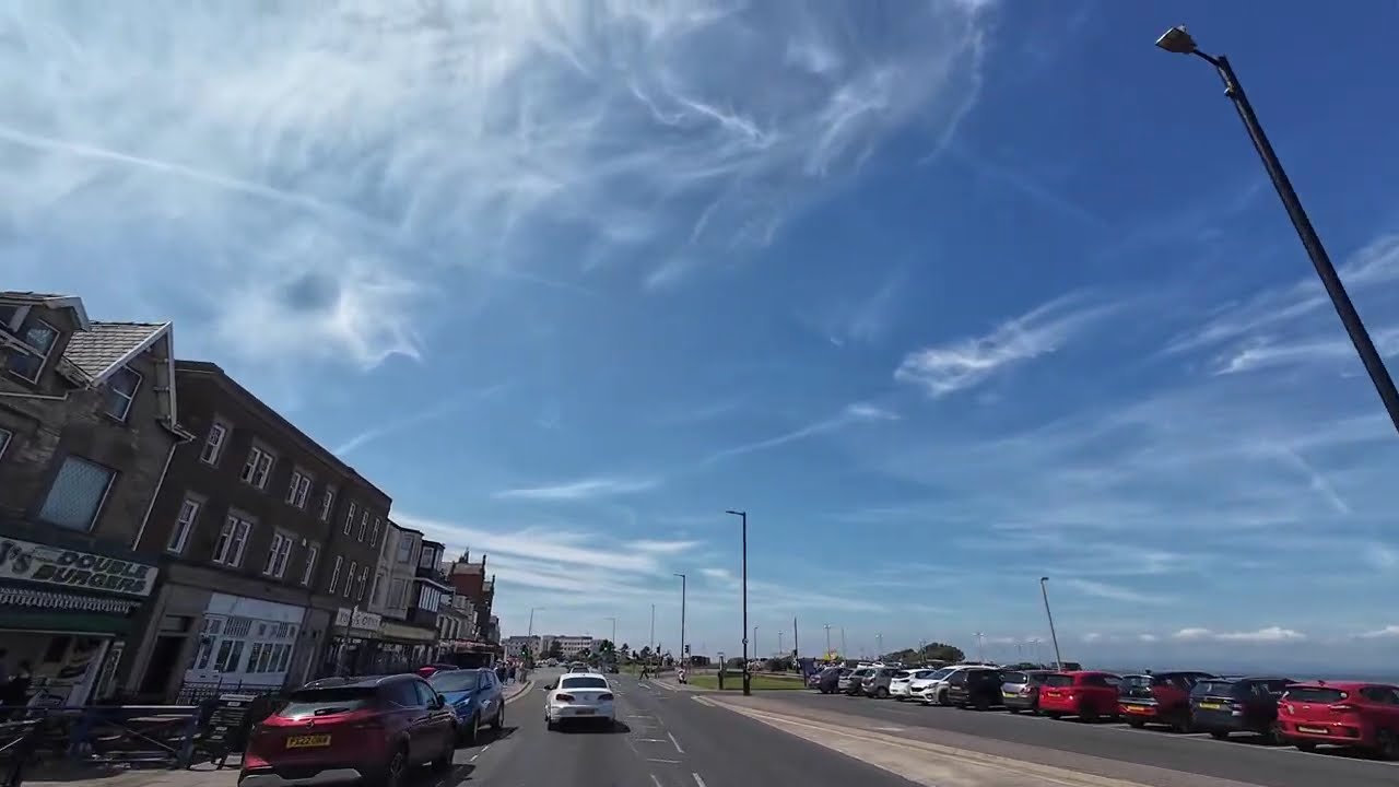 Riding around Morecambe streets on a Vespa! It is a lovely town.