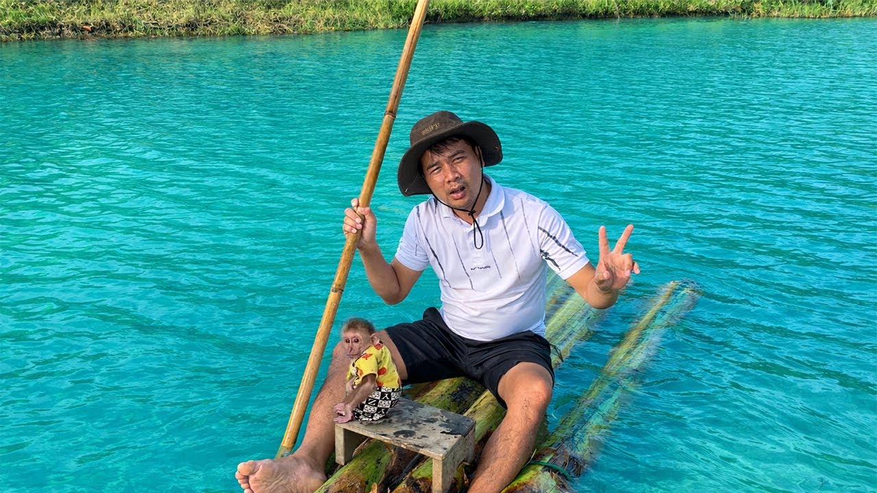 Hung's Father And Jobi Took A Boat Ride Around The Lake With The Ducklings.