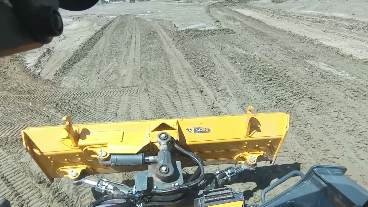 testing out a John Deere 333 skid steer with the dozer blade