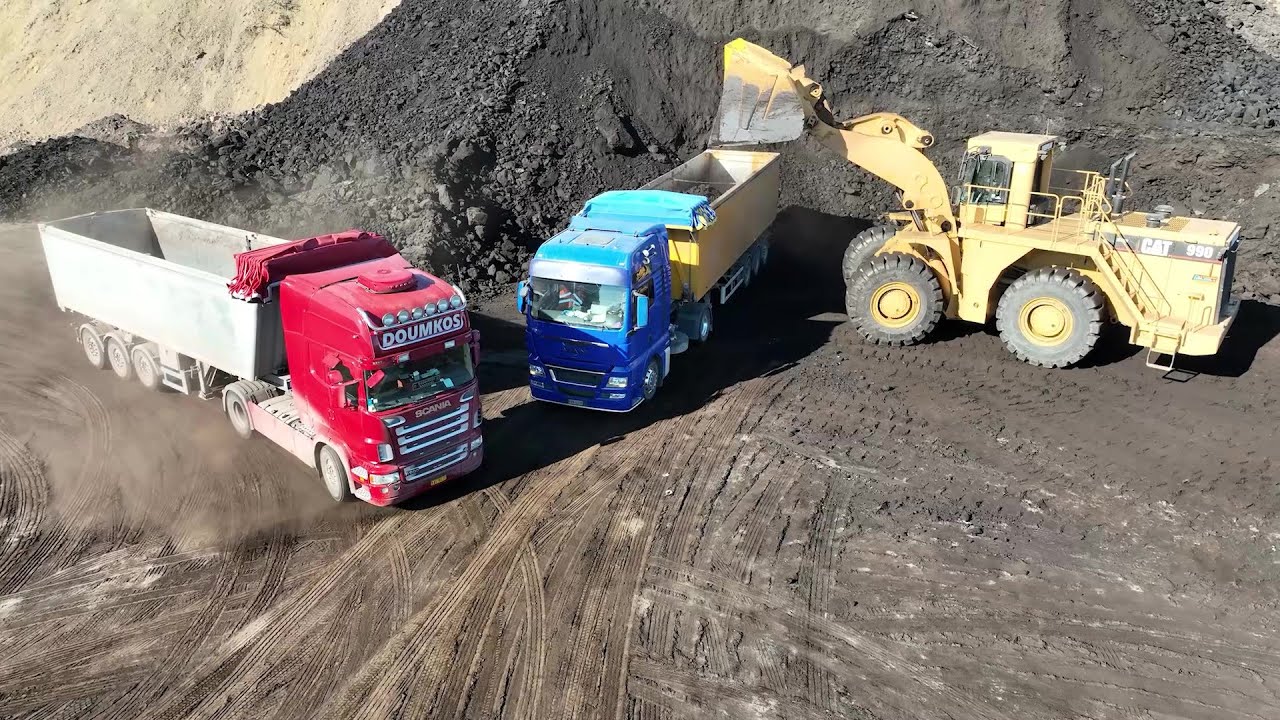 Caterpillar 990 Wheel Loader Loading Lorries With Two Passes - S.G.M Melidis - Drone View