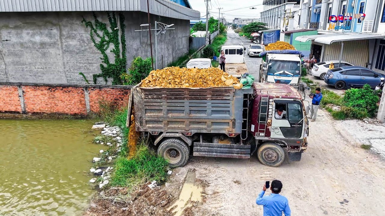 Perfectly Skilled Landfill delete flooded Driver DOZER KOMATSU D31P Pushing Soil &5TTrucks Unloading
