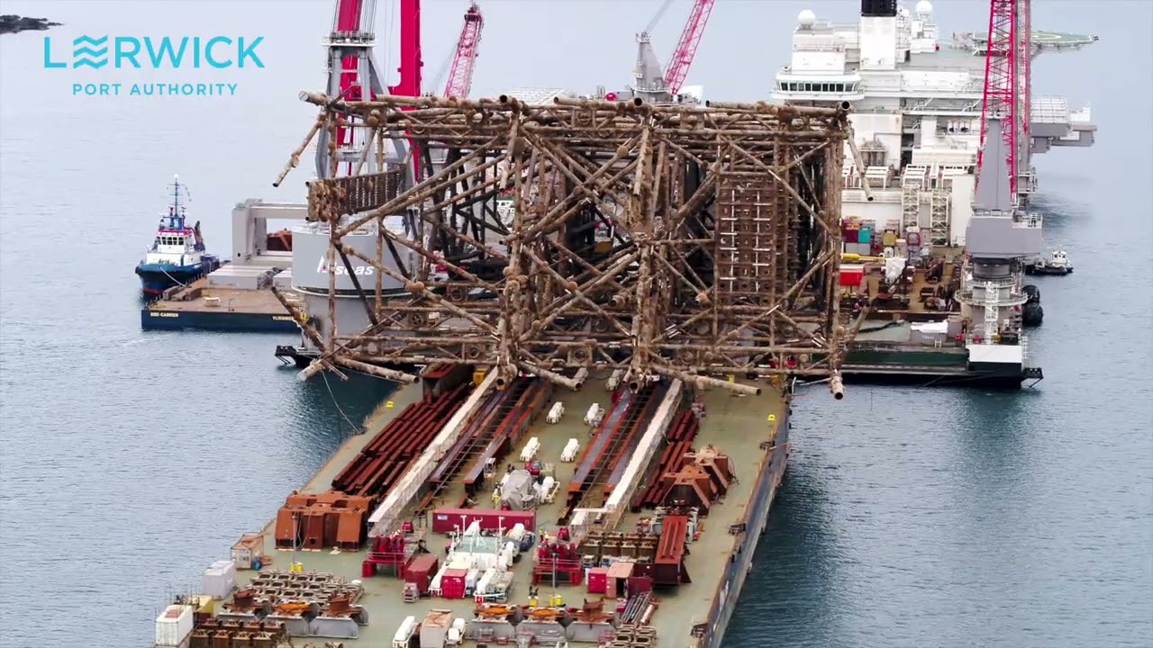 Pioneering Spirit's direct lift from quayside at Lerwick Harbour and jacket transfer to Dales Voe.