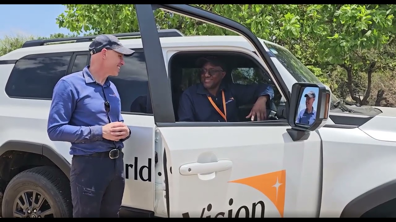World Vision International President Andrew Morley chats with World Vision Zambia's Driver Maxwell.
