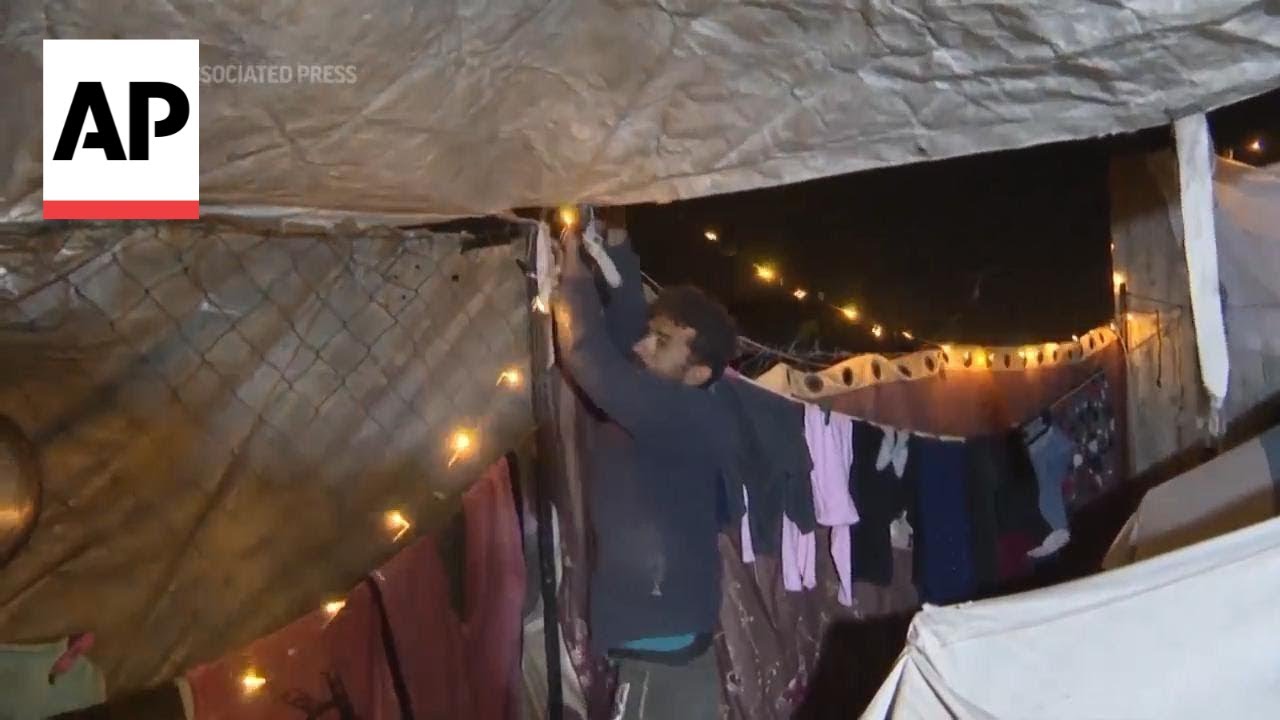 Displaced Palestinians in Gaza decorate their tents for Ramadan