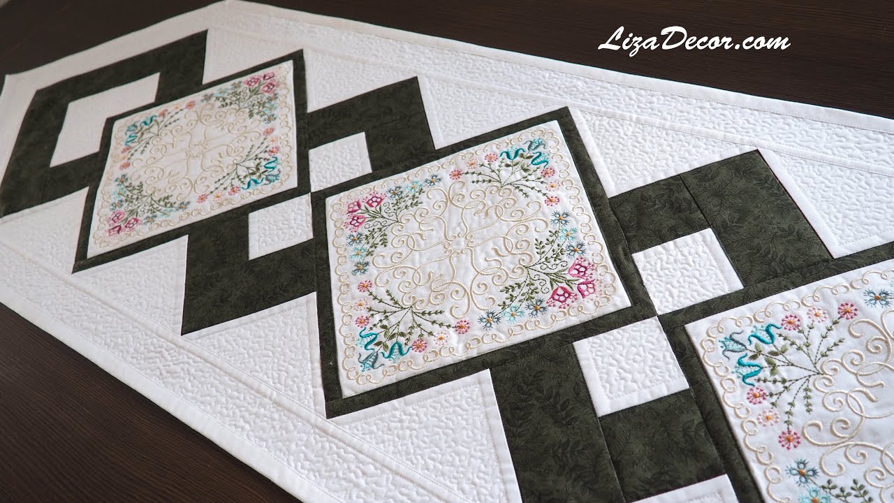 Sewing patchwork tablecloth with embroidery. 