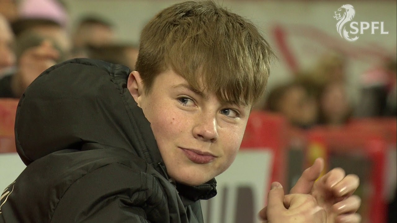 Cheeky ball boy laughs off an ear-bashing