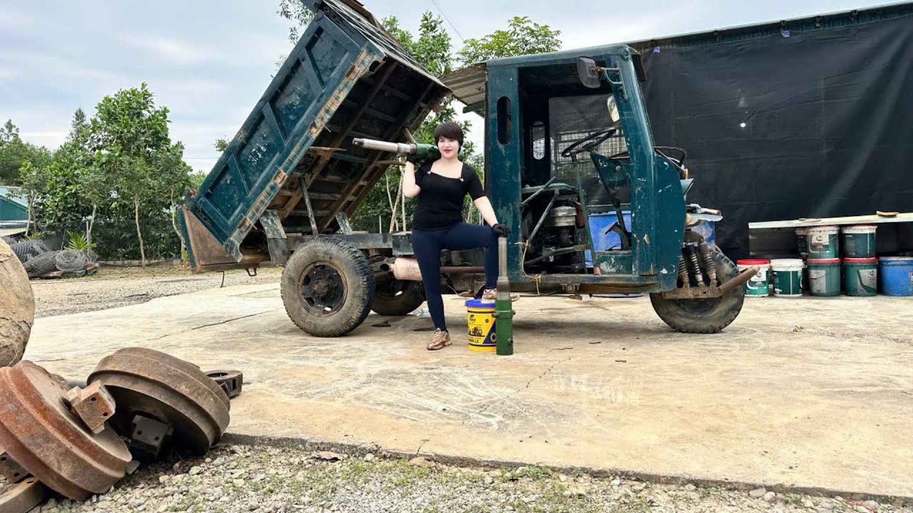 Outstanding skills: A young woman independently repairs truck lifts whenever customers request it.