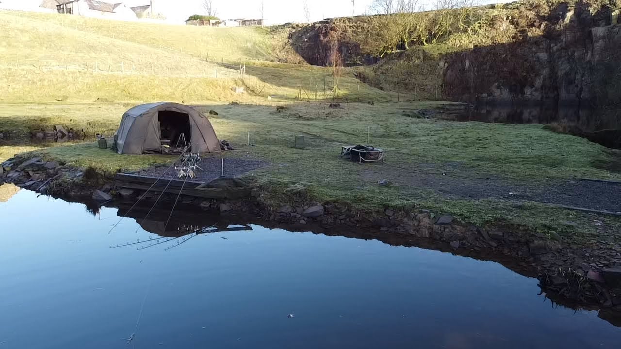 Quarry lake carping few fish on the bank