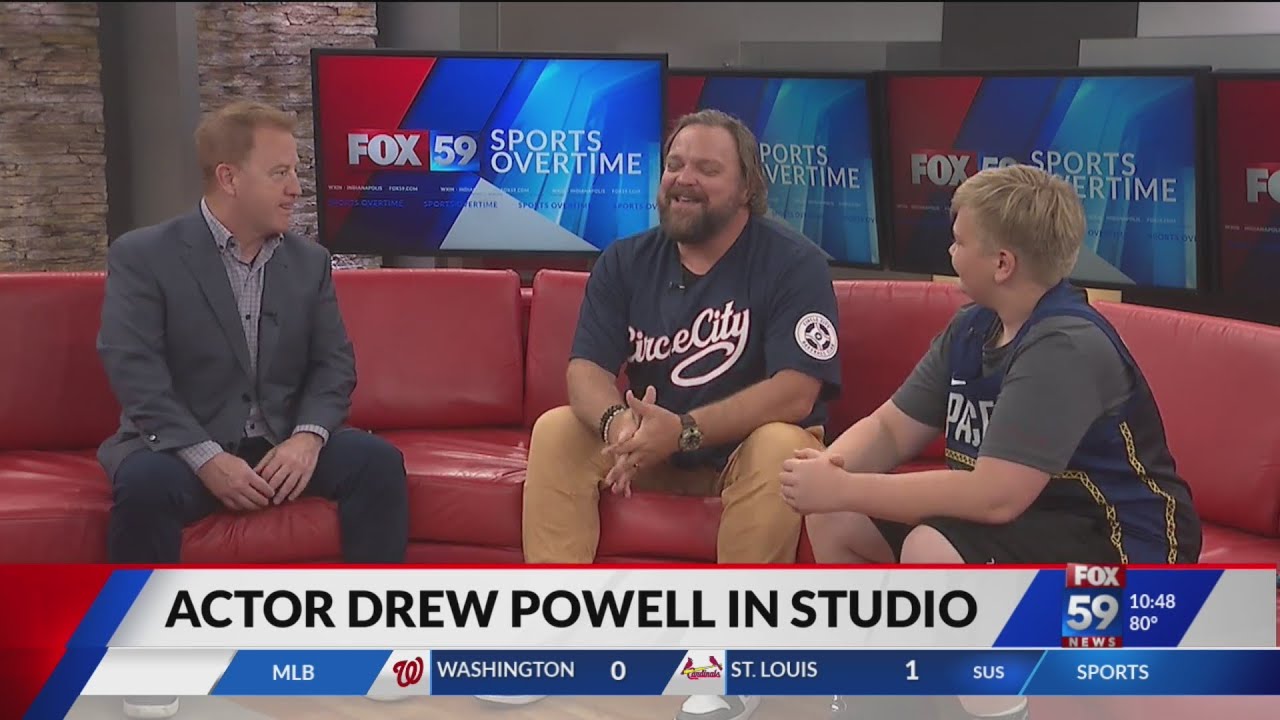 Actor Drew Powell on Red Couch