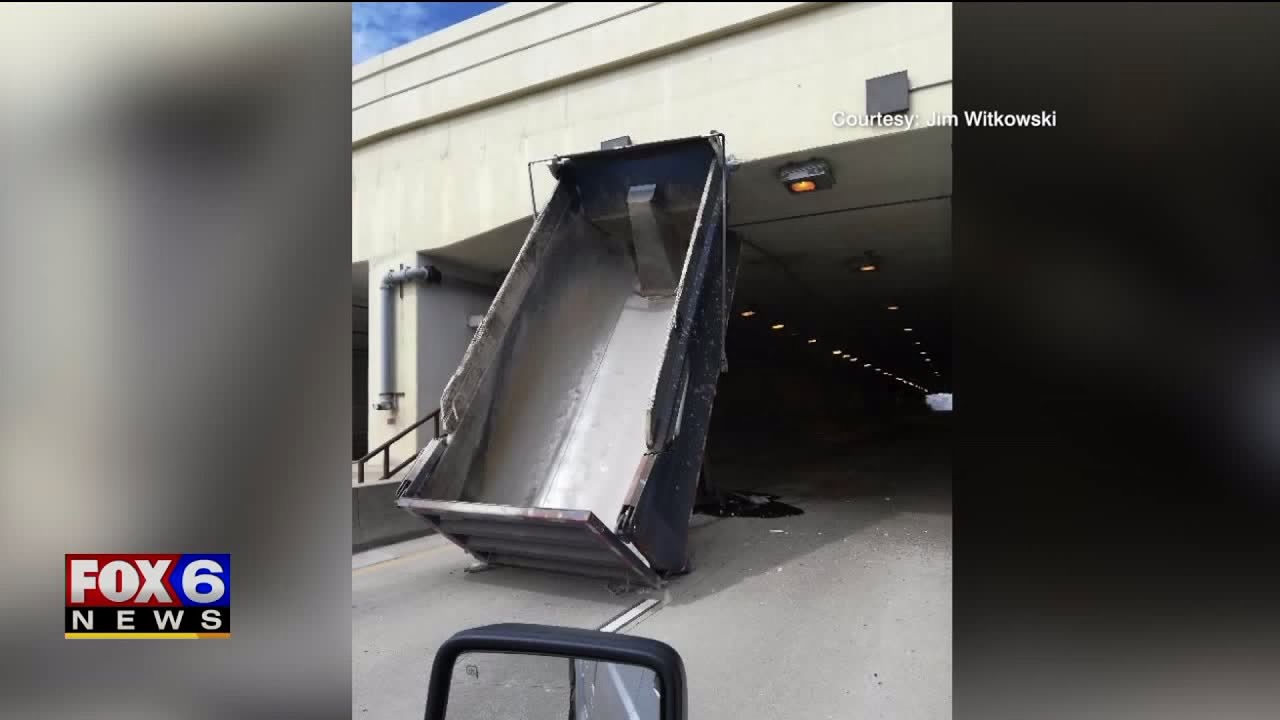 ‘Truck went by me and then BAM:’ Dump truck with bed in the air strikes bridge