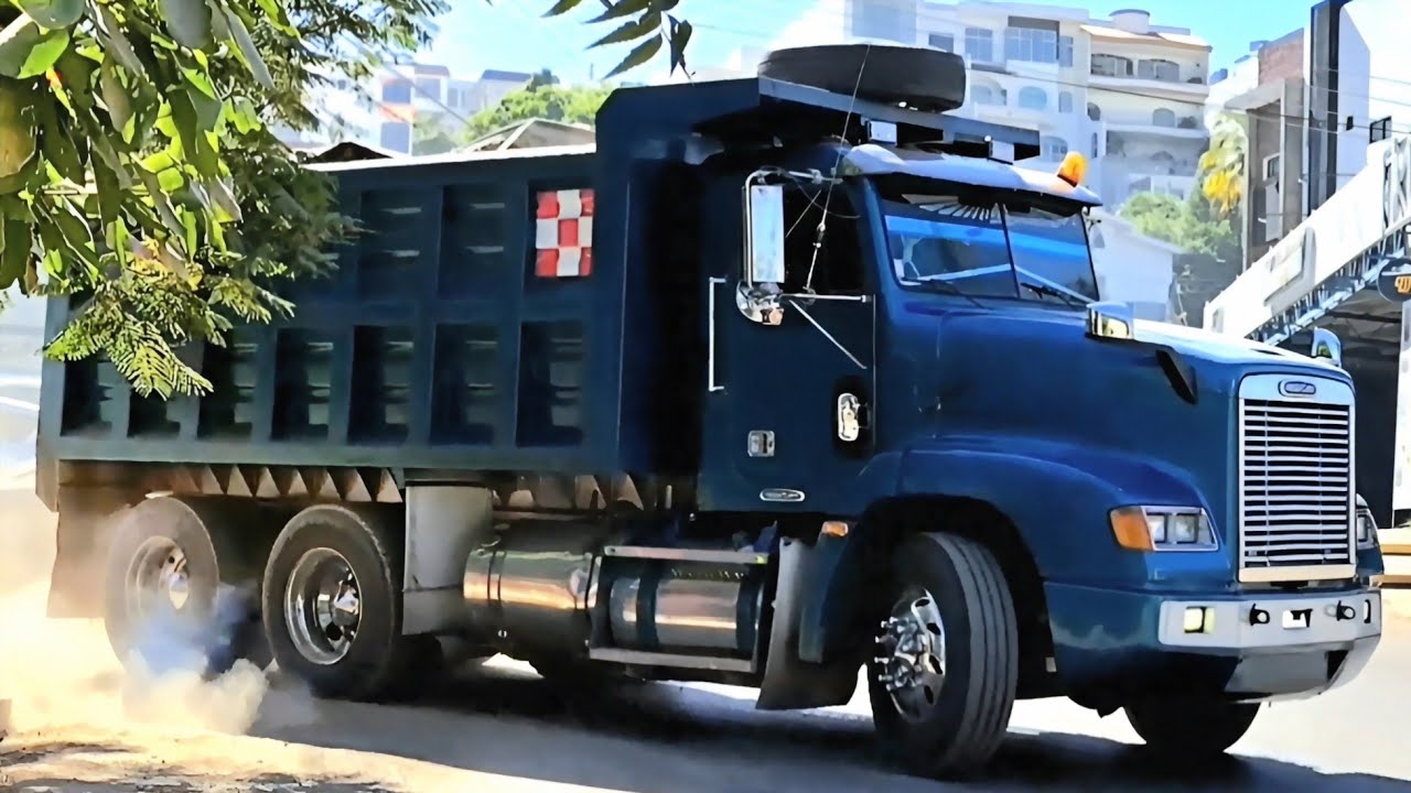 Powerful Dump Trucks in Action: Hauling and Unloading Material