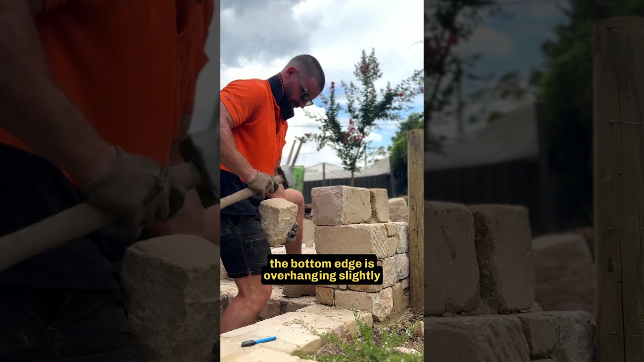Stonemason places the perfect corner stone #stonemason #stonework #landscaping