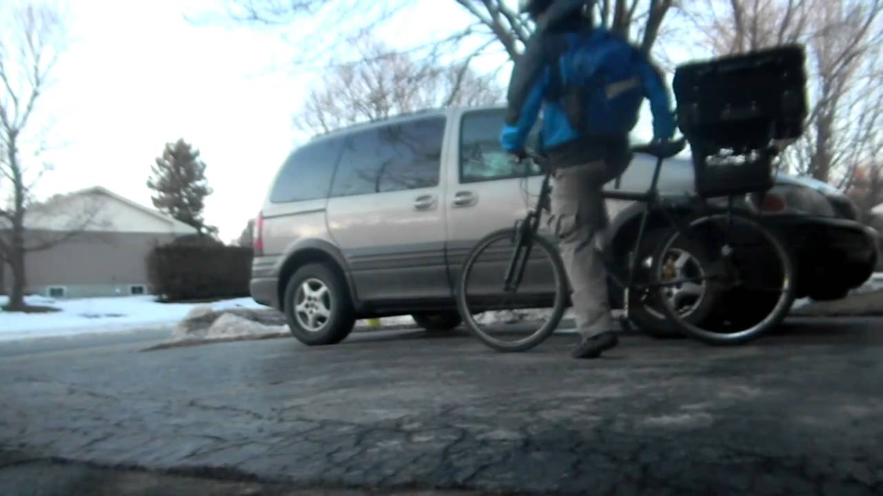 Bicycle Carrying Large Suitcase to the Train Station