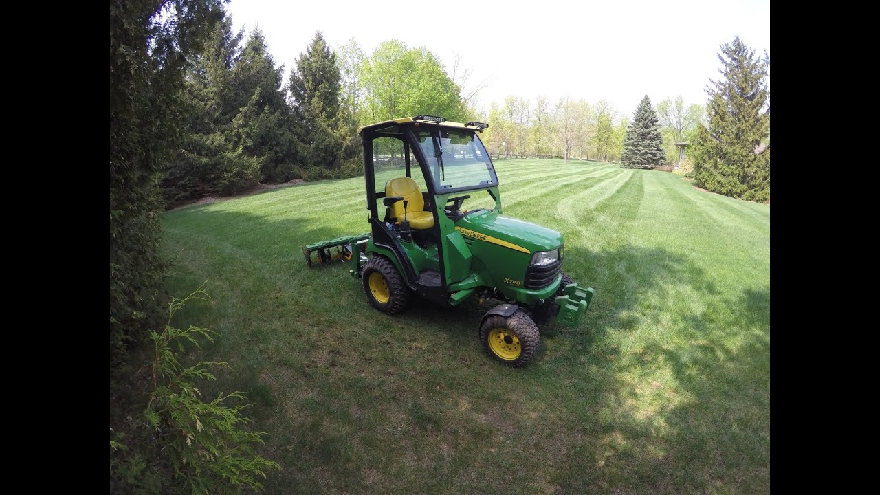 John Deere X748 - Core Aerating the Lawn - 20150510
