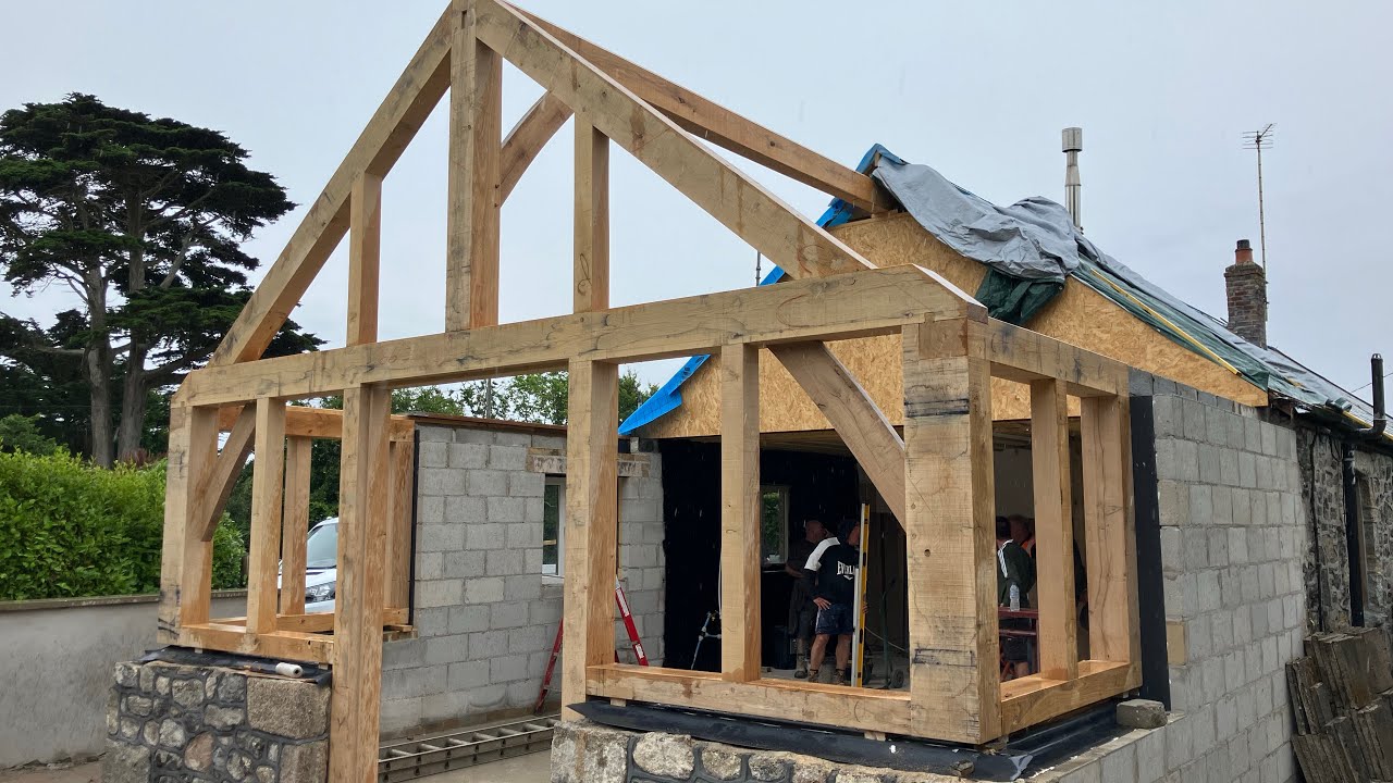 Erecting a traditional timber frame extension by Post and Beam ltd.