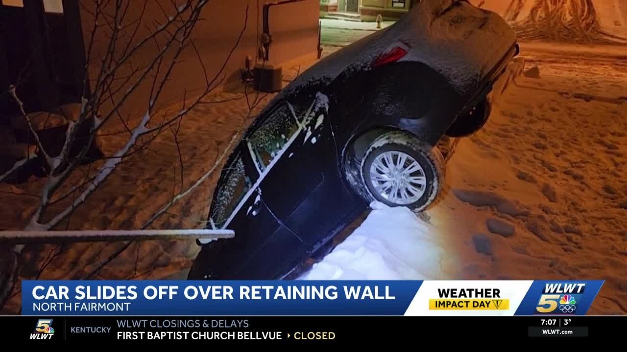 Car slides on slick Cincinnati roads, over retaining wall in North Fairmount