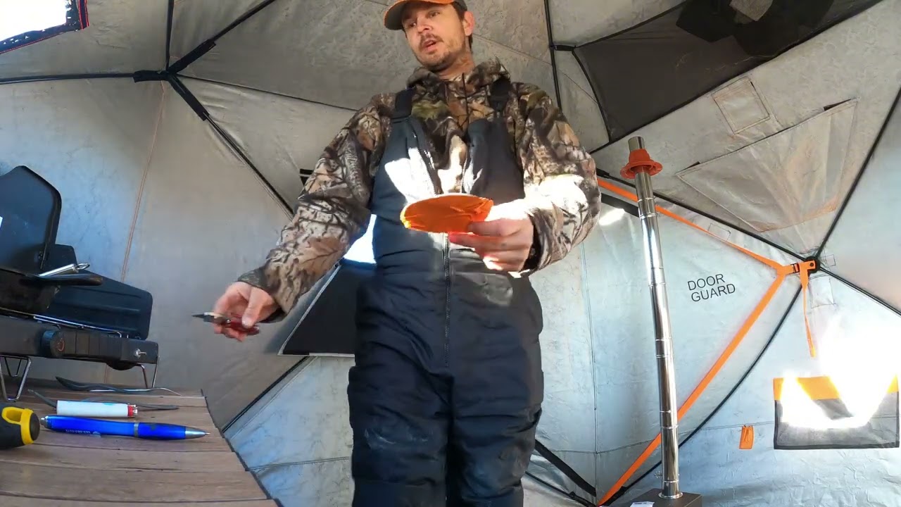 Installing silicone stove jack and stove into ice fishing tent