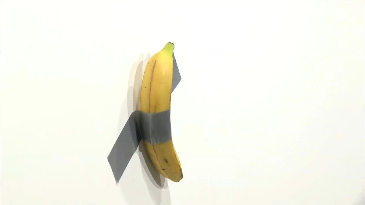 Man eats $120,000 piece of art - a banana taped to a wall | AFP