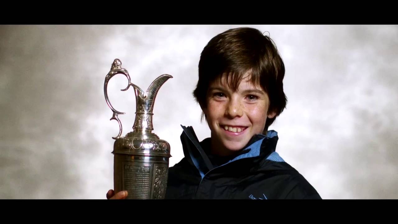 Fans at The Open hold the Claret Jug trophy