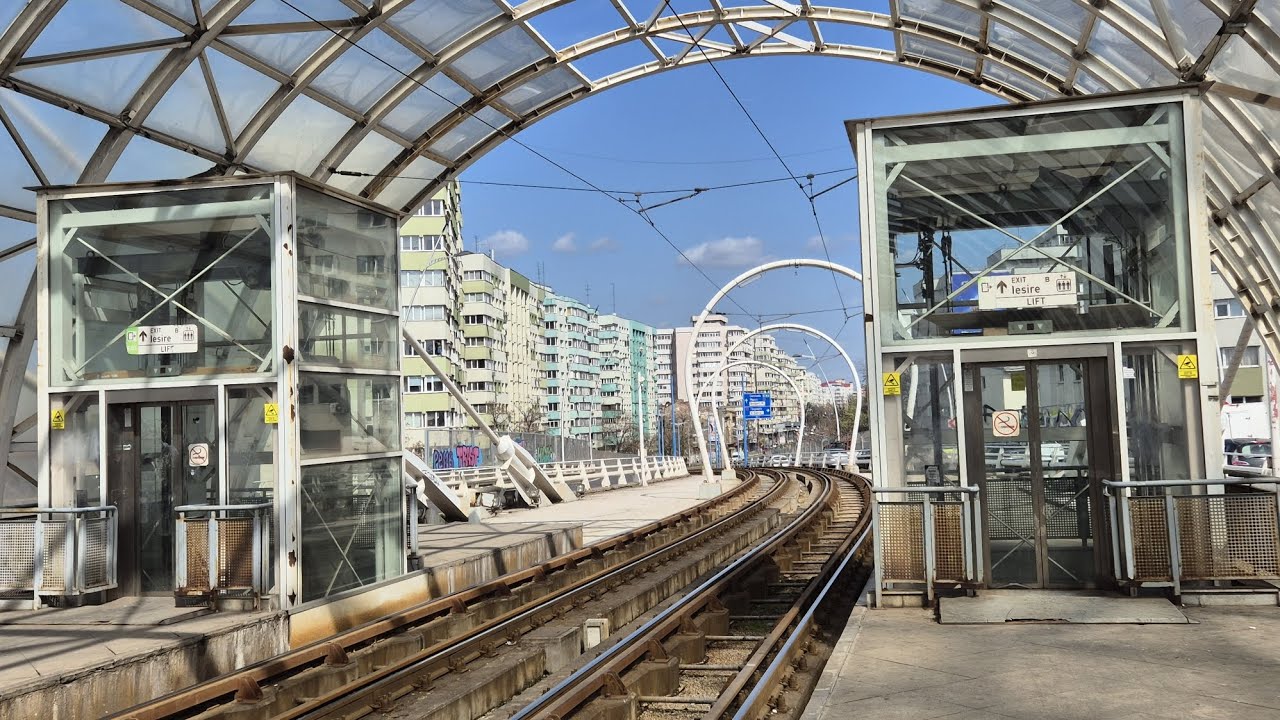 Poorly maintained glass ThyssenKrupp elevators at Pasaj Basarab tram station, Bucharest, RO