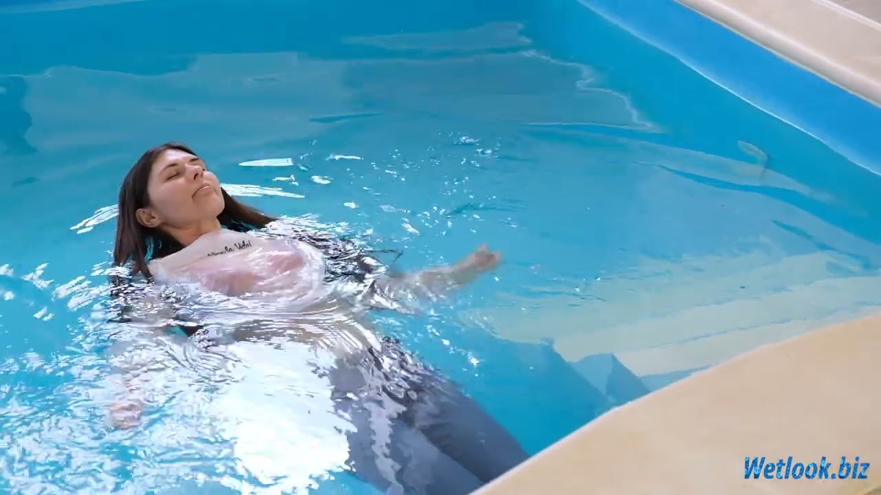 Wetlook girl fully dressed in jeans