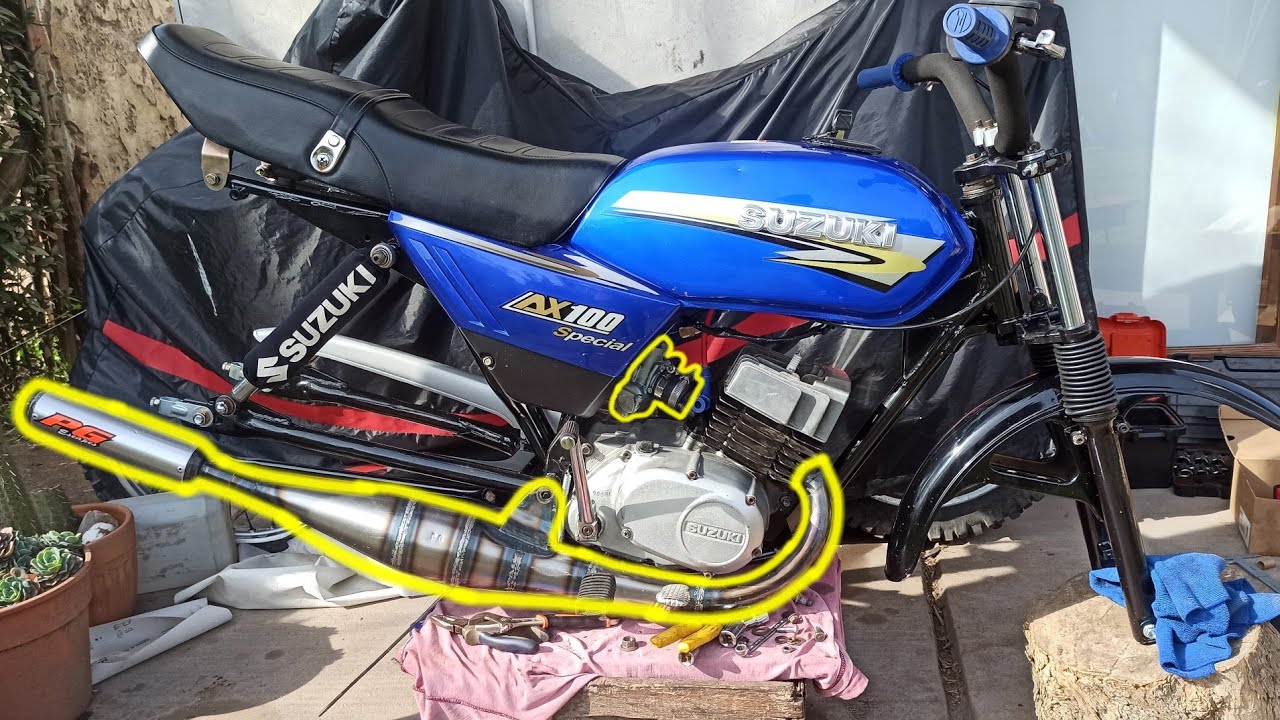 Escape pg Gordo y carburador de Yamaha RX en Suzuki AX100. (Pd sale mal)
