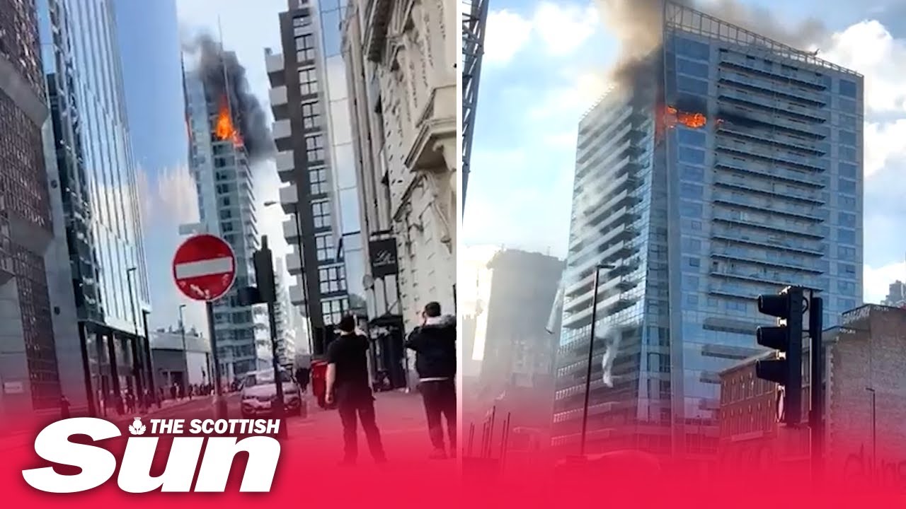 Moment huge glass panes plunge to ground as inferno rips through Whitechapel tower block