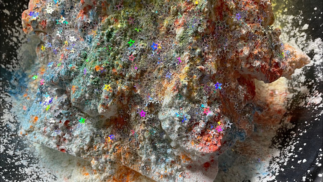 Mountain of Cloud Soap Topped With Cornstarch, Colorful Holi Powder, & Glitter On Fresh Gym Chalk