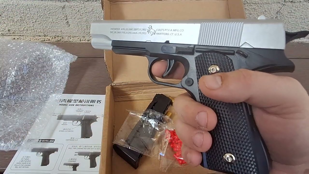 Unboxing Toy Colt 1911 semi-automatic shell ejecting pistol gun