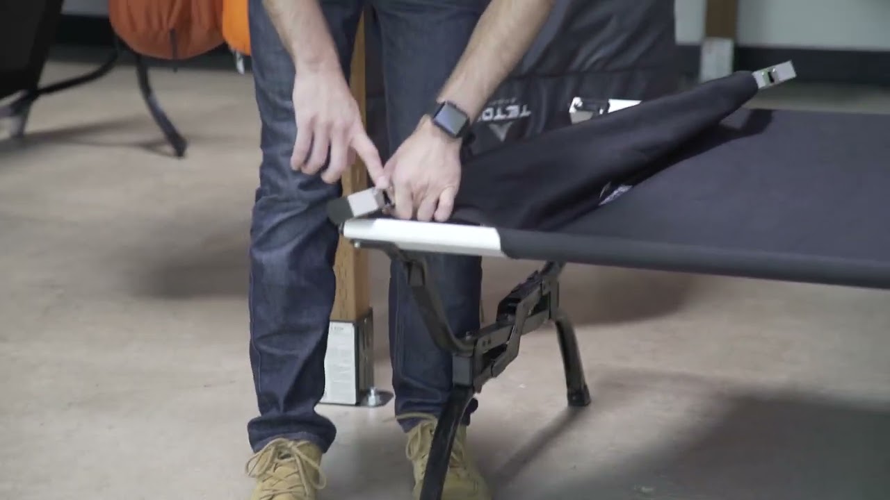 Setting up and taking down a cot
